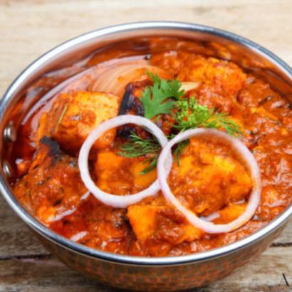 Kadai Paneer is a Traditional Indian dish made with Capsicum, Onions and tomato’s cooked together in an Indian Wok.
